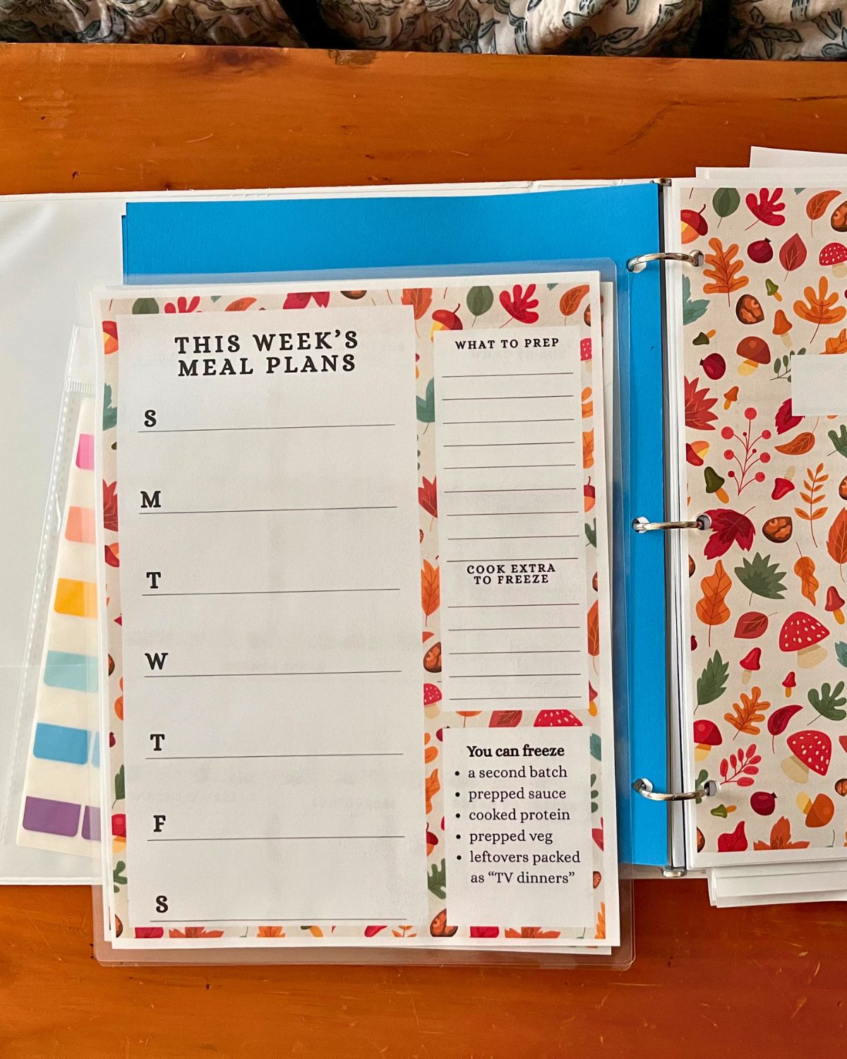 meal planning notebook on wood surface.