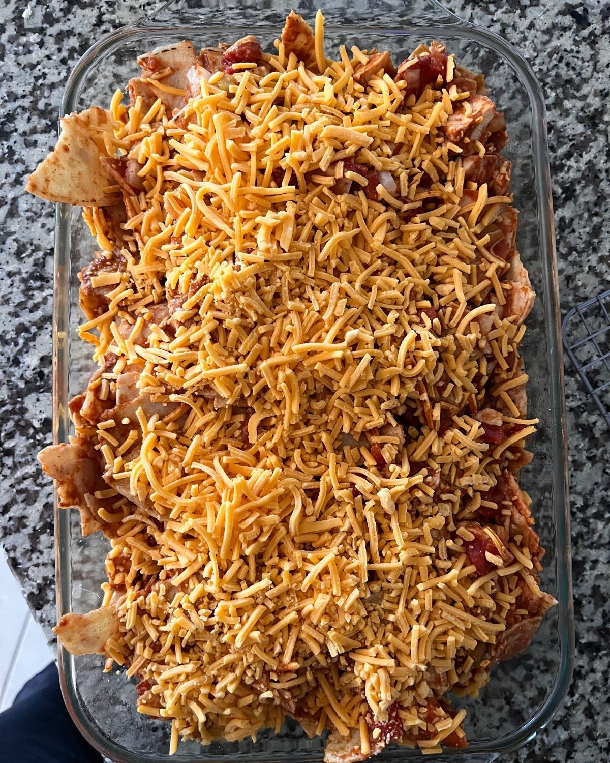 unbaked tortilla casserole on counter.