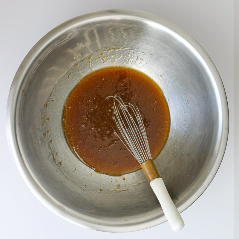 wet ingredients whisked together in bowl.