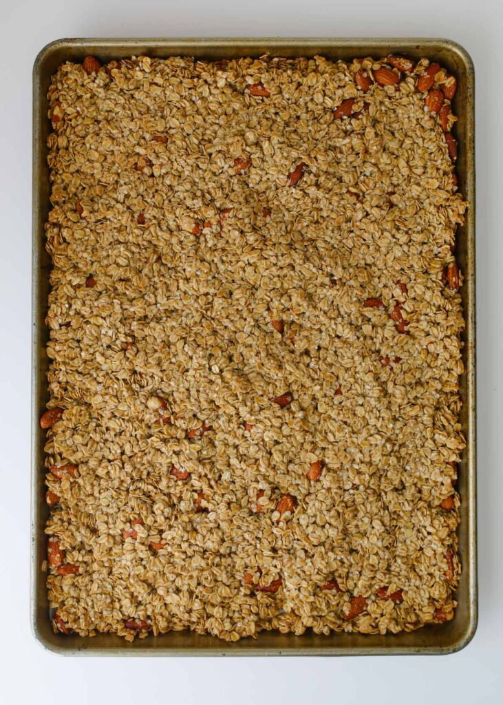 the semi-baked granola in baking pan.