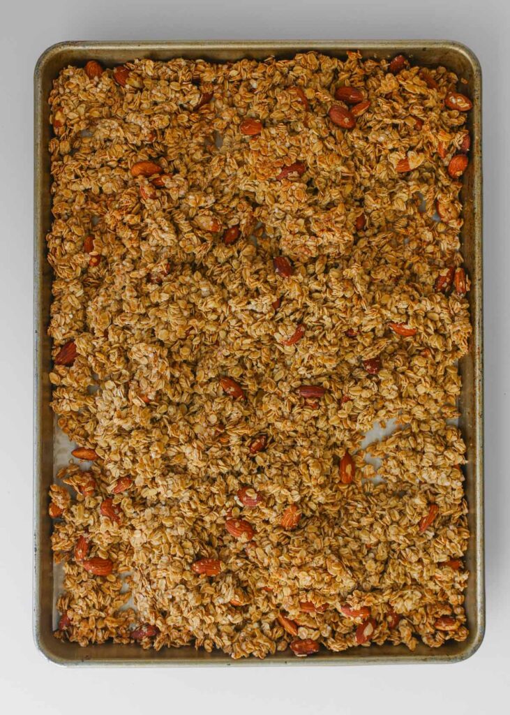 the fully baked granola in the baking pan.