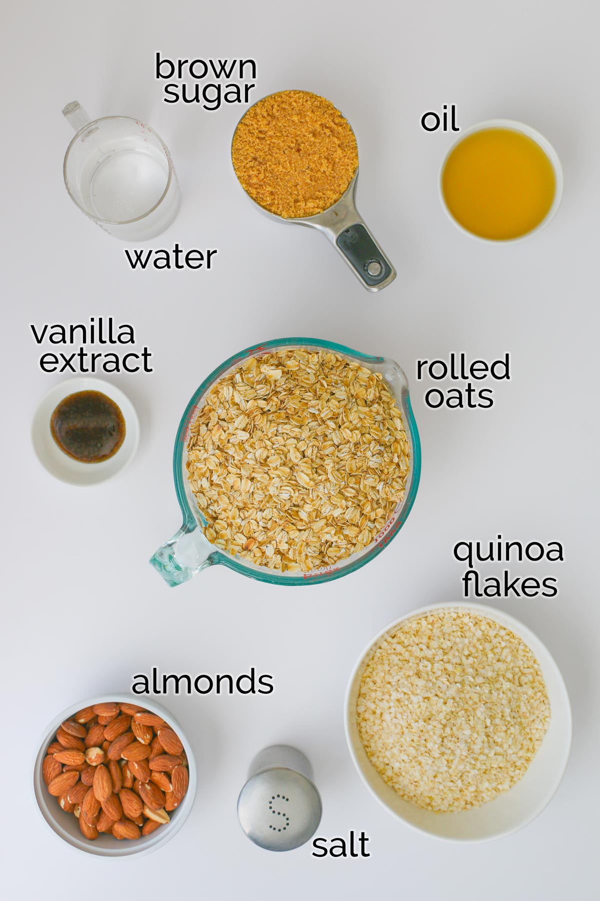 ingredients for granola laid out on white counter top.