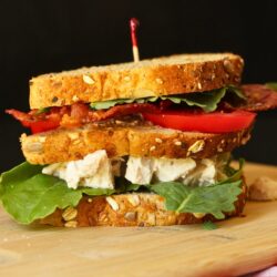 side view of double decker chicken salad club sandwich.