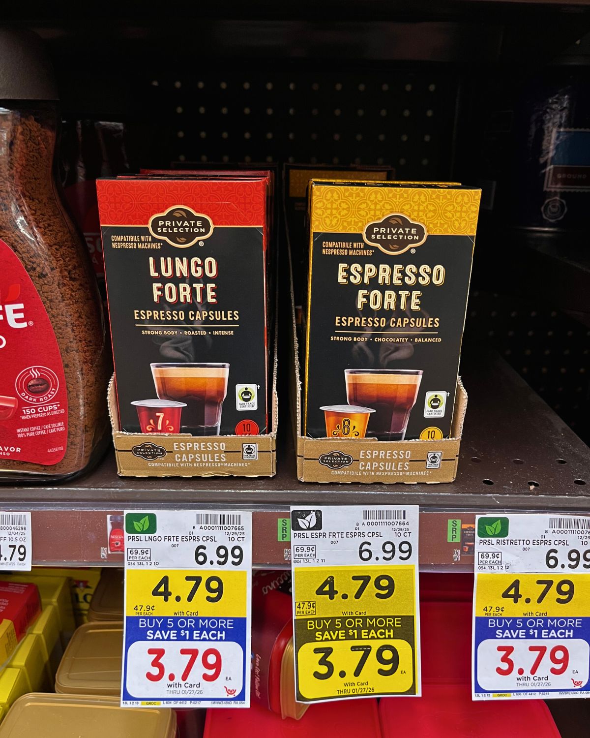 stacks of coffee pods, marked on sale on the shelf.