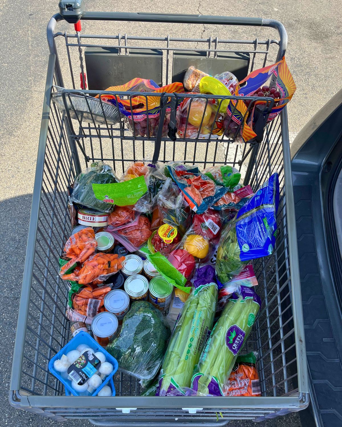 aldi grocery cart full of unbagged groceries.