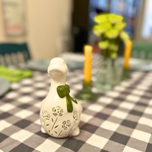 dinner table set with spring decor.