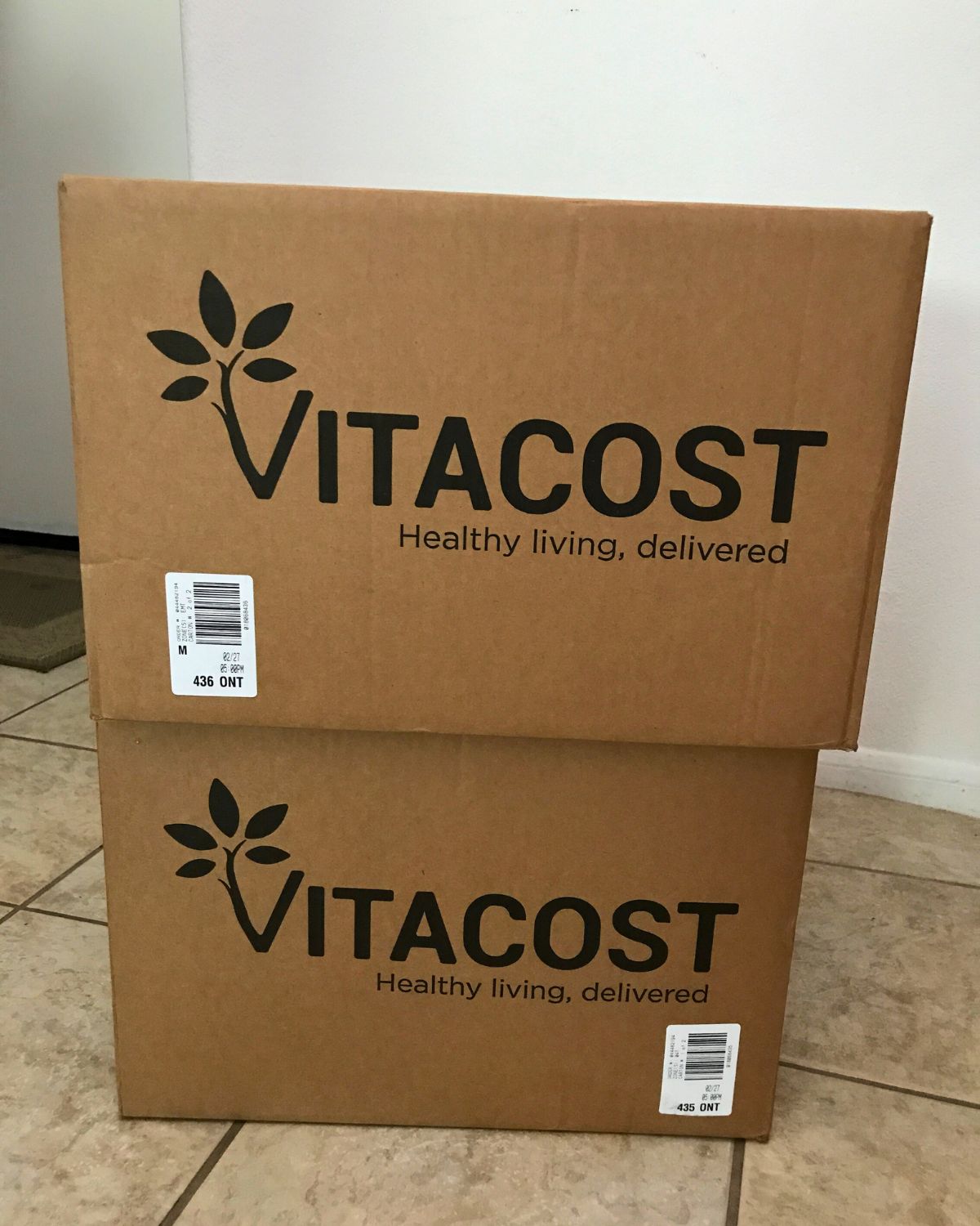 vita cost boxes stacked in foyer.