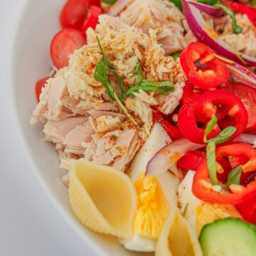 square crop of tuna on pasta salad.