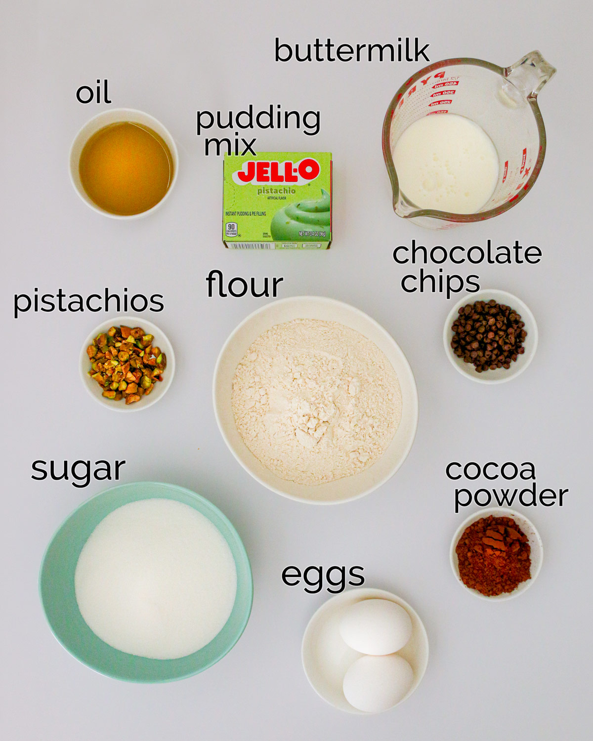 ingredients for loaf cake laid out on white counter.