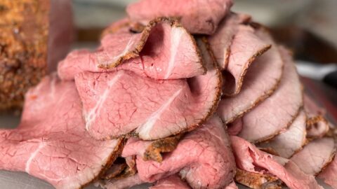 sliced roast beef on cutting board.