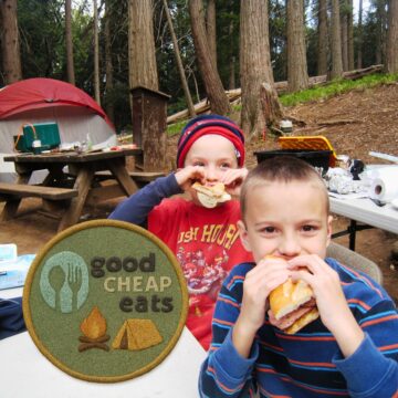 boys eating while camping with overlay of camping badge.