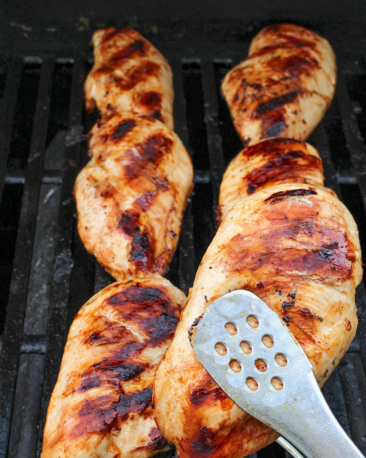 chicken cooking on grill.
