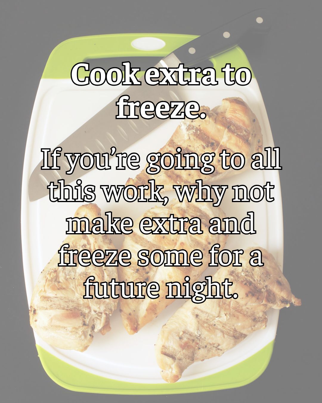 grilled chicken on cutting board, sliced ready to freeze.