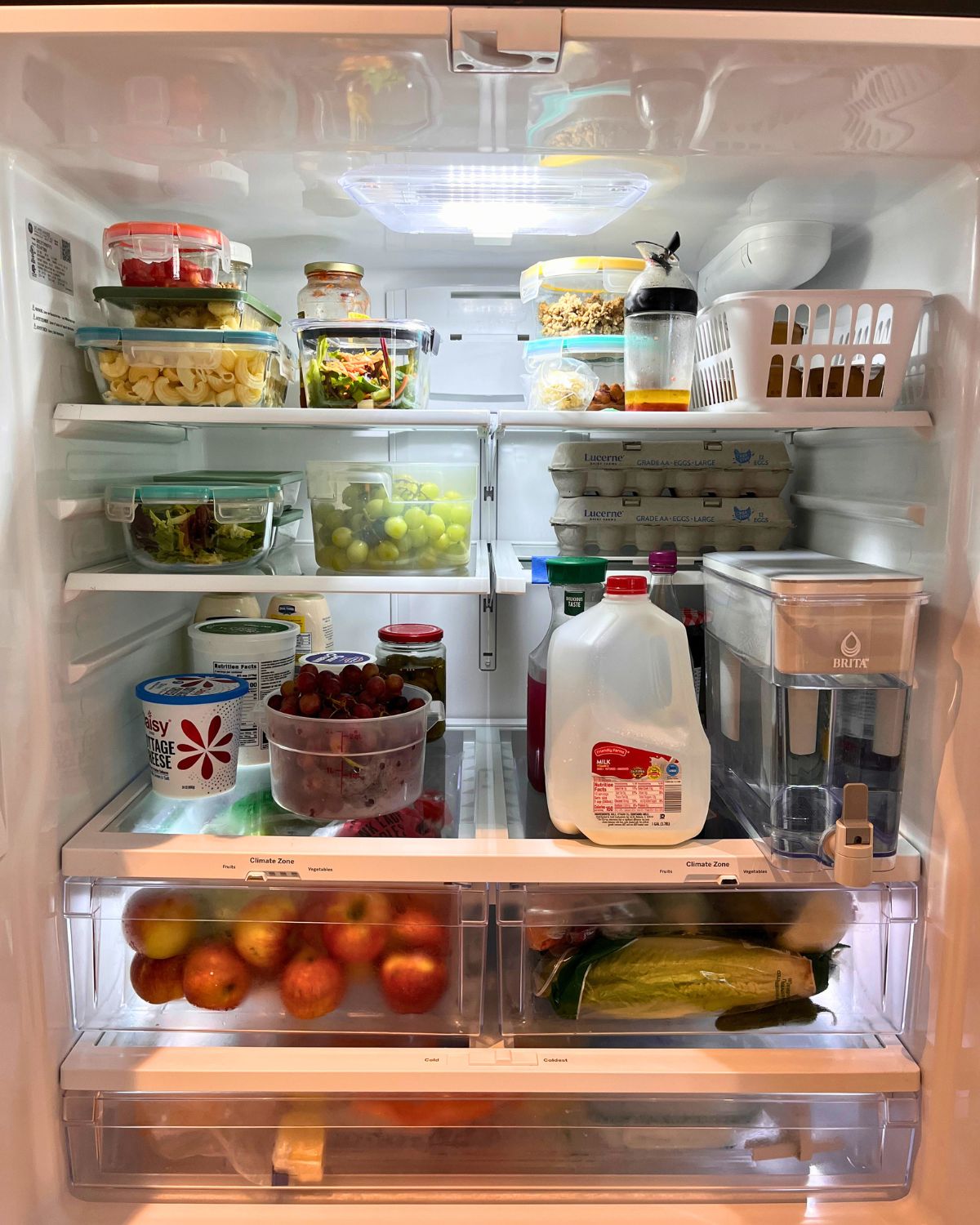 open refrigerator full of food.